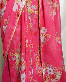 Pink Digital floral printed Georgette saree with lace attached paired up with plain contrast black silk blouse.