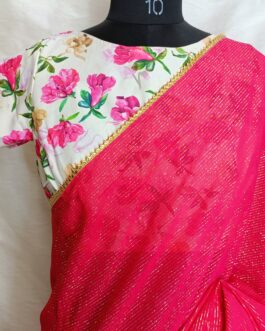 Georgette hot pink with zari lines all over saree  with lace attached paired up with American crepe floral print fancy  blouse.