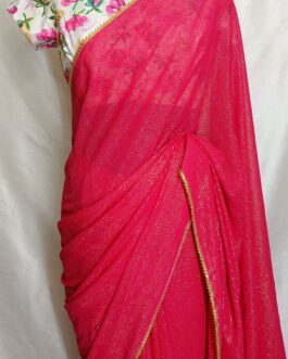 Georgette hot pink with zari lines all over saree  with lace attached paired up with American crepe floral print fancy  blouse.